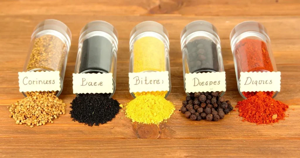 Corned beef spices in glass containers with wooden spoons