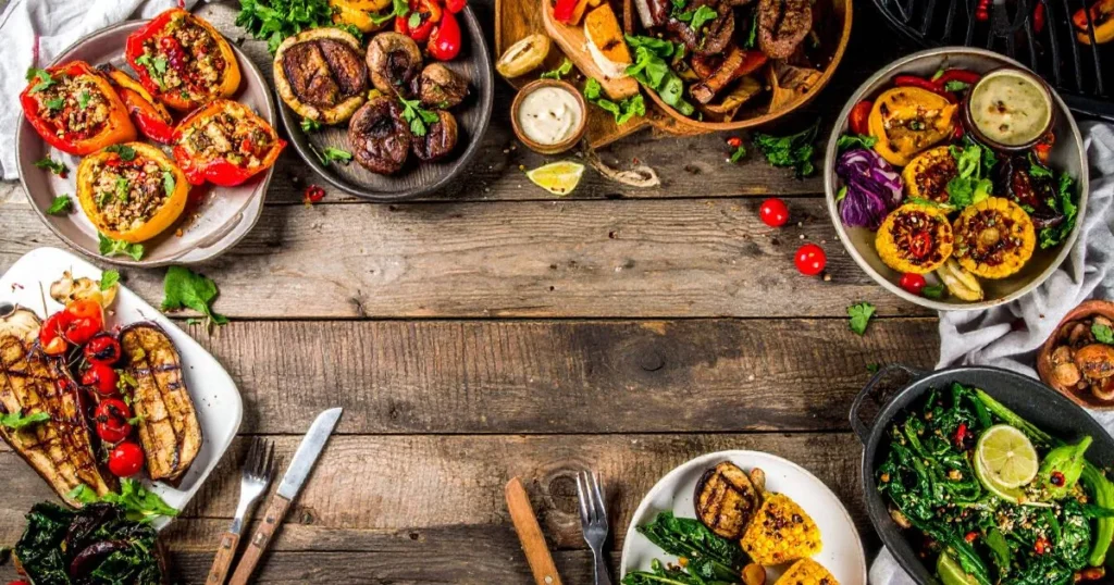 Traeger Vegetarian Recipes featuring smoky grilled portobello steaks, maple-glazed acorn squash, quinoa-stuffed peppers, and wood-fired seasonal vegetables packed with flavor.