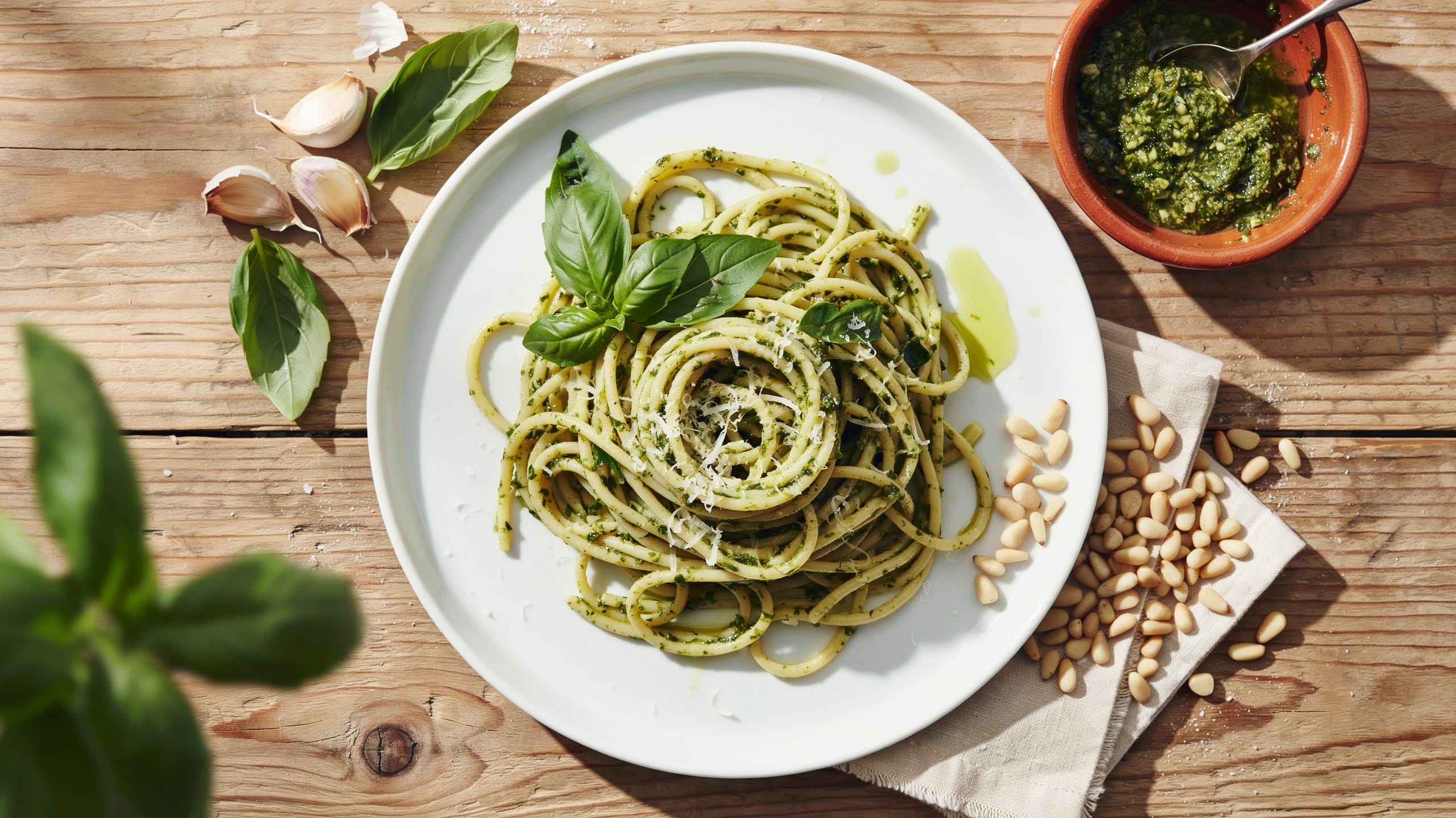 Creamy-pesto-pasta-recipe-with-vibrant-basil-sauce-and-cherry-tomatoes-for-an-easy-Italian-dinner